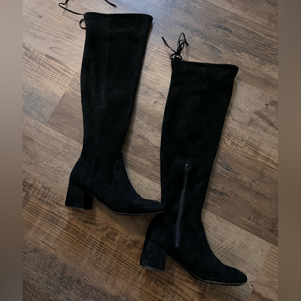 Over the knee black suede boots.